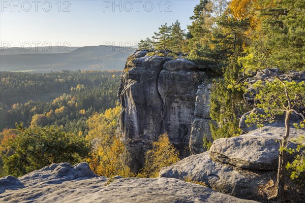Rocks and autumnal mixed forest on the Pfaffenstein