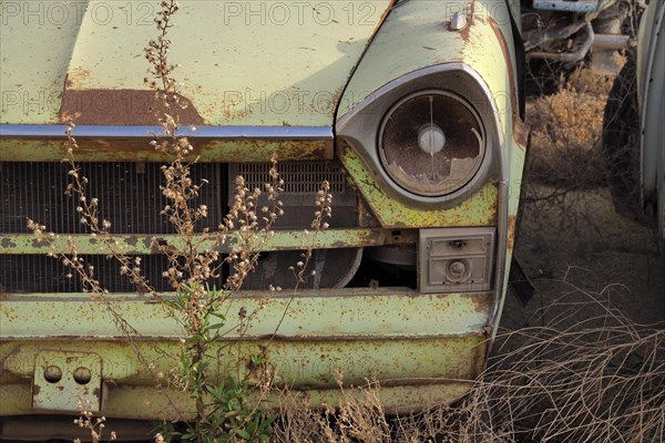 Lamp and radiator grille of a scrapped Peugeot