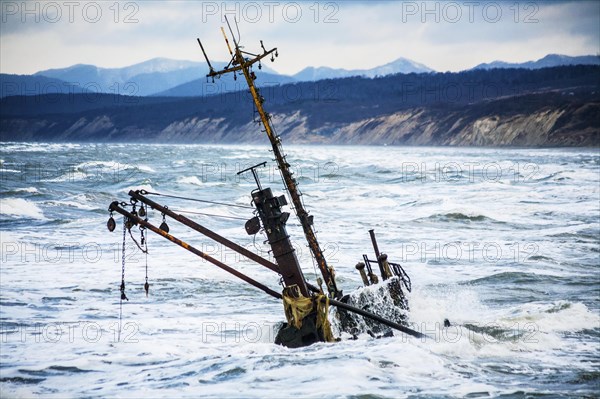 A sunk ship in the fierce sea of Okhotsk