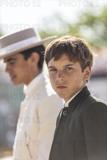 Portrait of young men in traditional clothes during the Feria de Abril in Seville