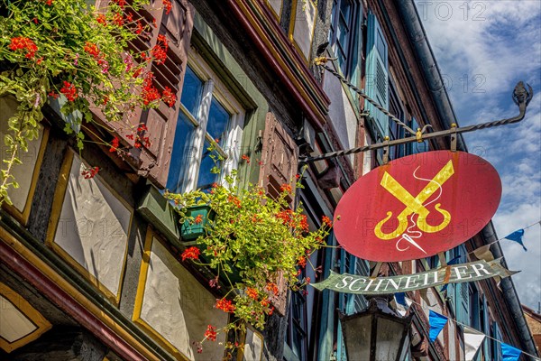 Decorative craftsman's symbol on a half-timbered house