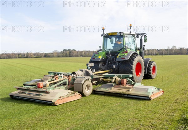 Fendt 313 tractor mowing grass