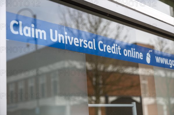 Claim Universal Credit online banner message in window of Job centre