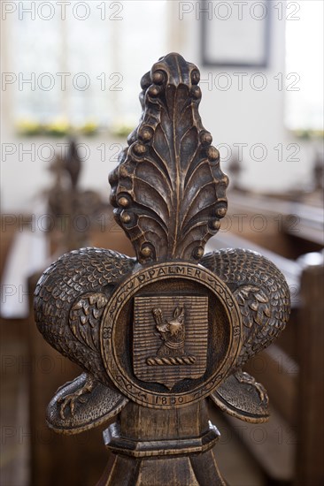 Carved wooden pew end by P Palmer 1850