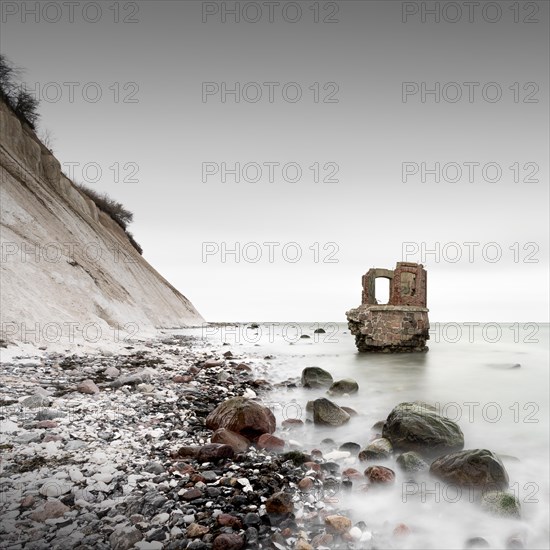 Old tide gauge house on the beach near Kap Arkona on the German island of Ruegen