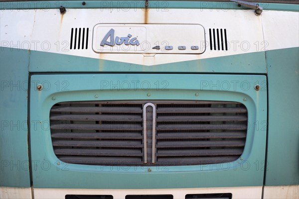 Front view of mint green Avia van