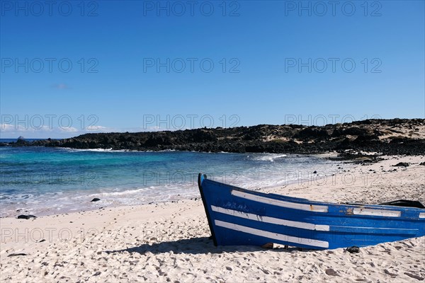 Stranded fishing boat on Caleta del Mojon Blanco beach