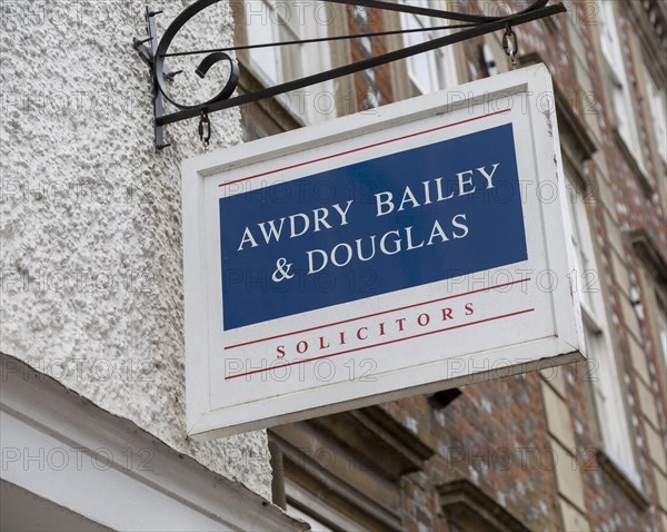 Sign on wall for Awdry Bailey and Douglas solicitors