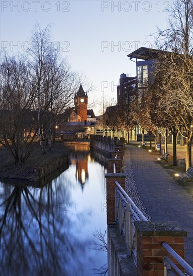 St. Anthony's Parish Church and Old Town Hall Tower with the River Dinkel in the Evening