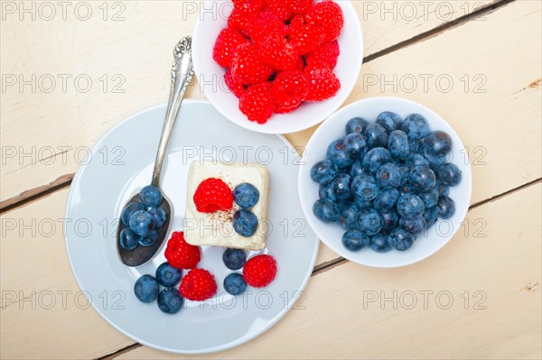 Fresh homemade raspberry and blueberry cream cake