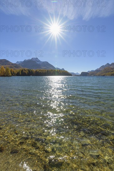 Lake Silsersee with sun in autumn