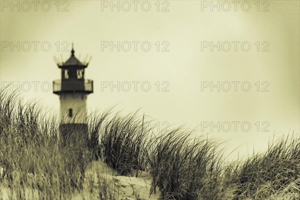 List-ost lighthouse with dune landscape