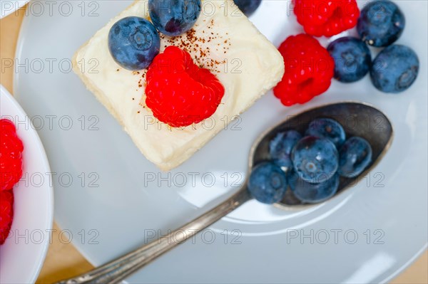 Fresh homemade raspberry and blueberry cream cake