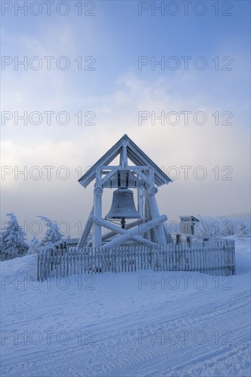Peace bell on the summit of Fichtelberg with snow in winter
