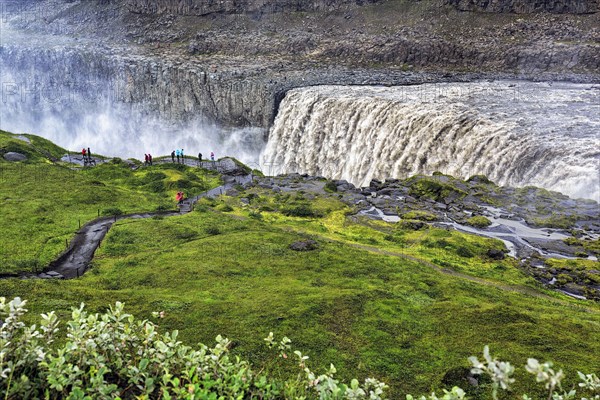 Hikers at the edge of Dettifoss