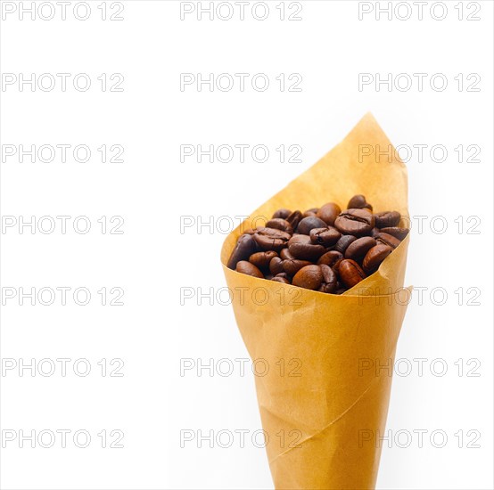 Espresso coffee beans on a paper cone cornucopia over white background