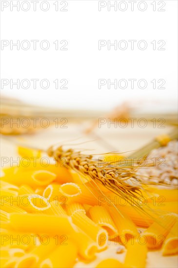 Short Italian pasta penne with durum wheat grains