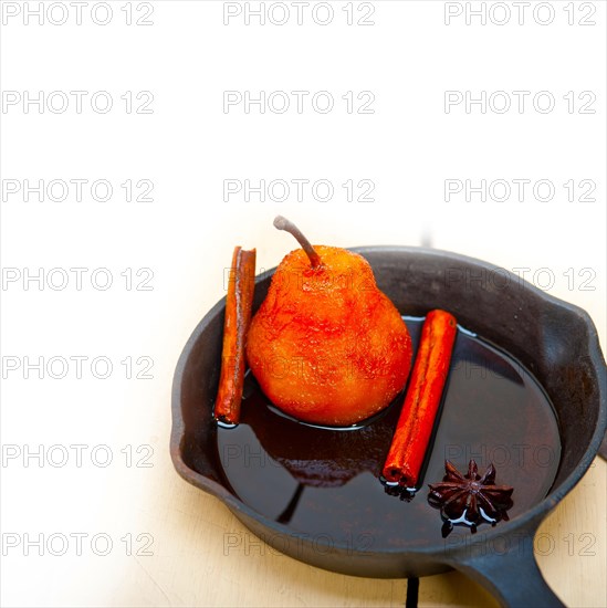 Poached pears delicious home made recipe ove white rustic wood table