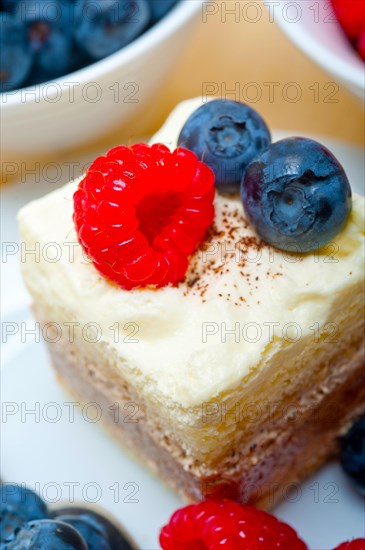 Fresh homemade raspberry and blueberry cream cake