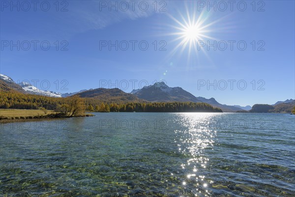 Lake Silsersee with sun in autumn