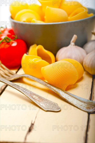 Italian snail lumaconi pasta with ripe cherry tomatoes sauce ingredients