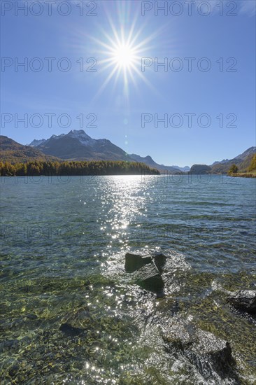 Lake Silsersee with sun in autumn