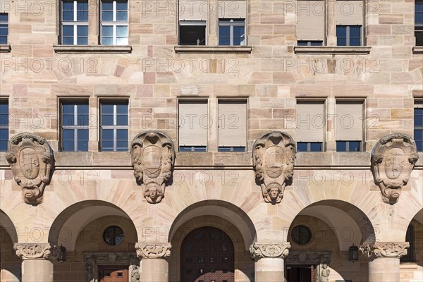 Main facade with four coat-of-arms cartouches