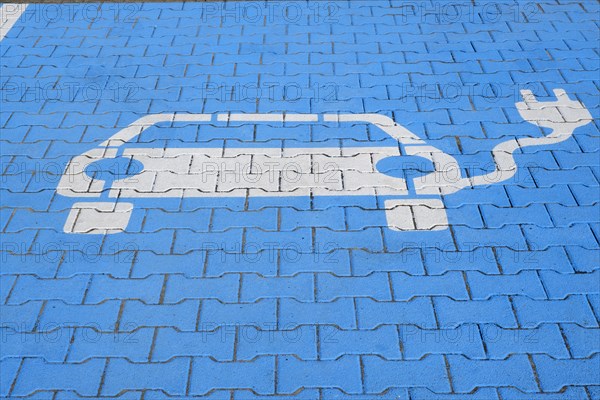 Ground marking pictogram on car park for electric vehicles