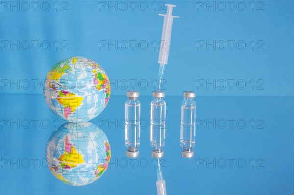 Vaccine bottles and syringe