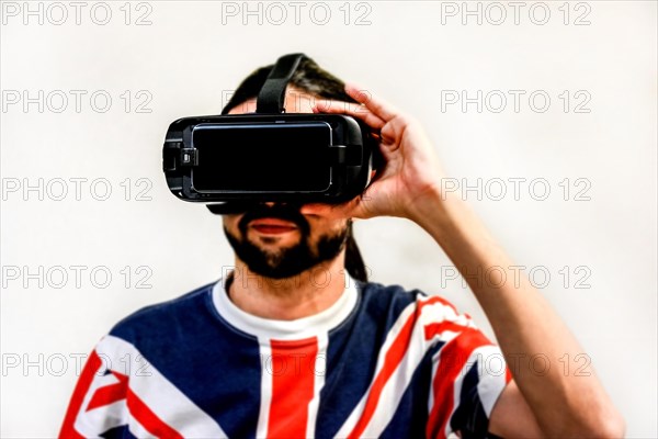 Man on white background with Virtual Reality headsets on