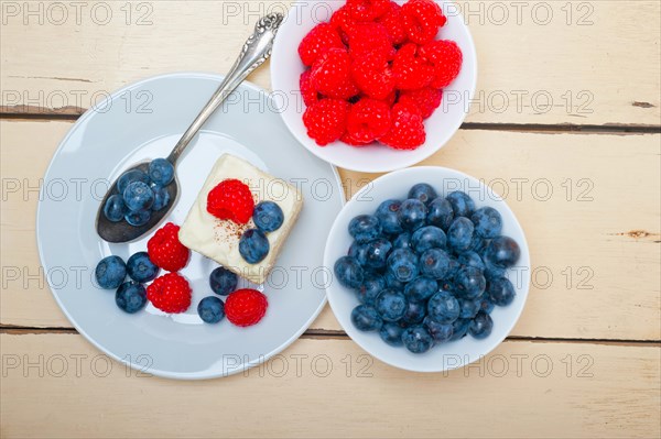 Fresh homemade raspberry and blueberry cream cake