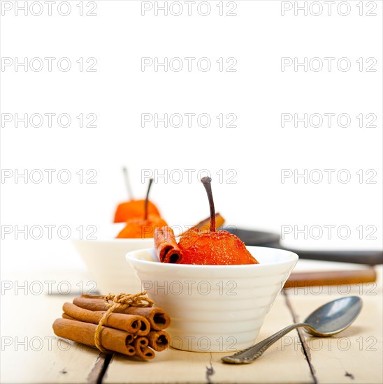 Poached pears delicious home made recipe ove white rustic wood table