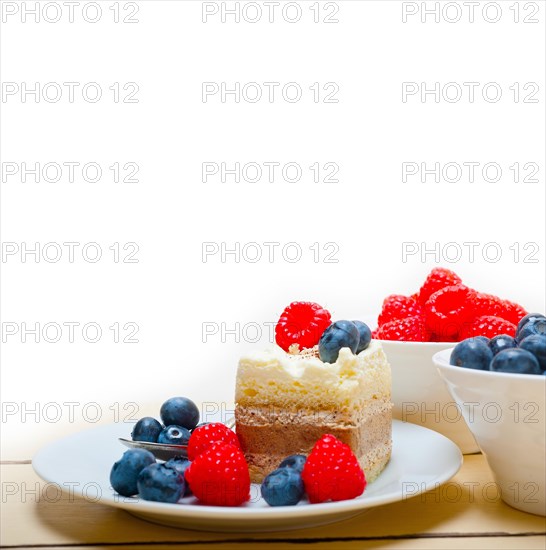 Fresh homemade raspberry and blueberry cream cake