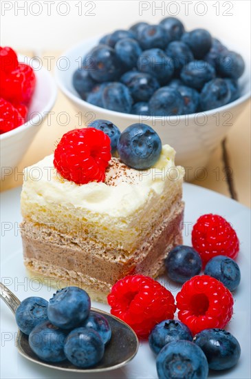 Fresh homemade raspberry and blueberry cream cake