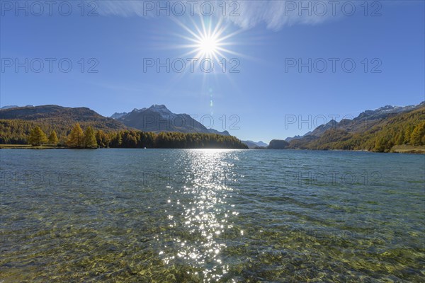 Lake Silsersee with sun in autumn