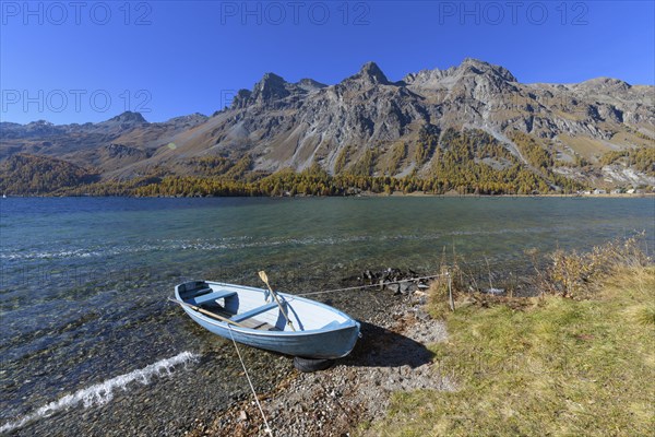 Lake with boat in autumn