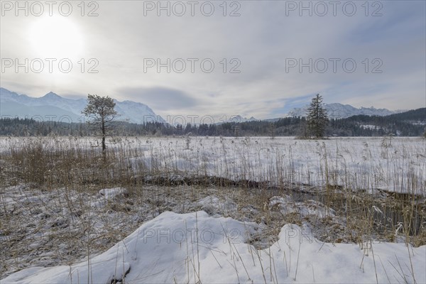 Lake Barmsee with Karwendel mountainrange on morning in winter