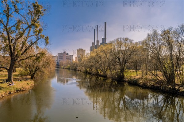 The river Ihme with the combined heat and power plant called "the three warm brothers" and the Ihme Centre in the background in the district of Hannover-Linden