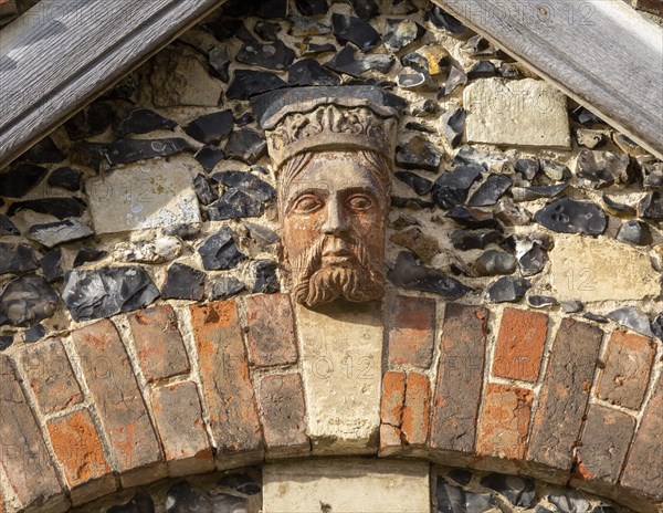 Carved face and head of Tudor figure