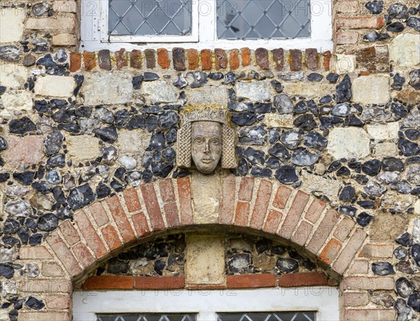 Carved face and head of Tudor figure