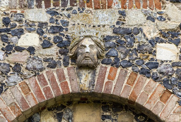 Carved face and head of Tudor figure