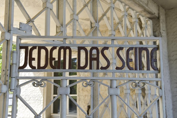 Lettering in the camp gate To each his own
