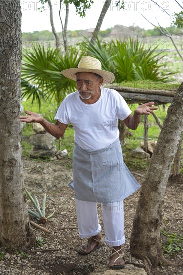 Old farmer explaining the production of sisal