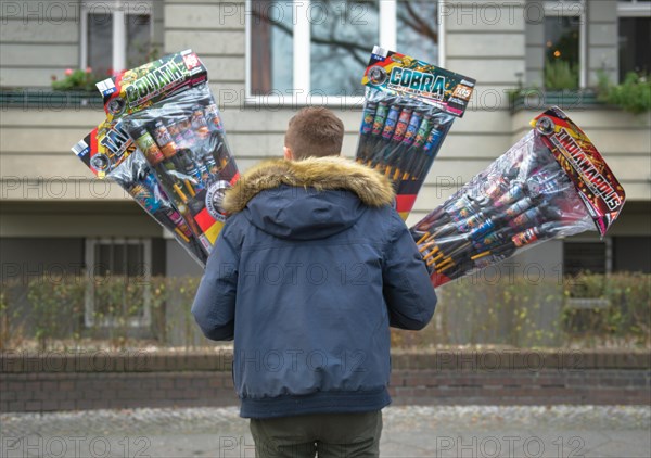 Man with many New Year's Eve rockets