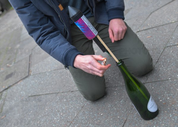 Launching a New Year's Eve rocket from a bottle