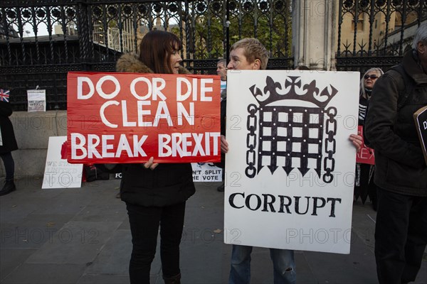 Leave means Leave supporters of Brexit holding placards at the Palace of Westminster