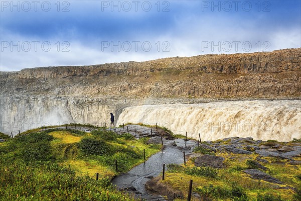 Hikers at the edge of Dettifoss