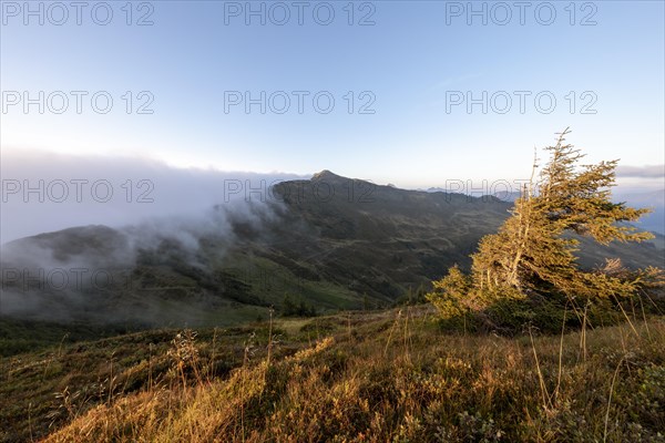 Fog in the high valley on an autumn evening at Potlakopf