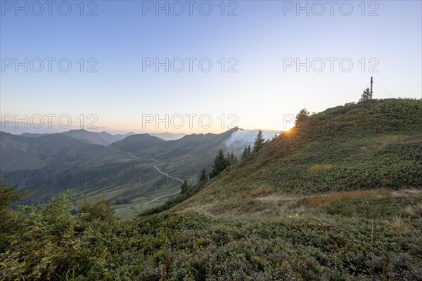 Summit cross in the morning light on Portlakopf