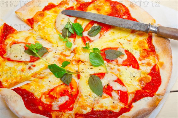 Italian traditional pizza Margherita tomato mozzarella and basil